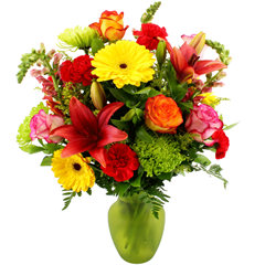 Assorted Fall Vase includes roses, lilies, carnations, spider mums, snapdragons all in a green vase