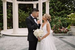 Ranunculus & White Peony Bridal Bouquet - Round Clutch Style